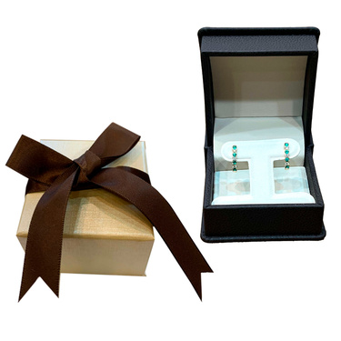 Emerald rings in The Natural Emerald Company custom made packaging